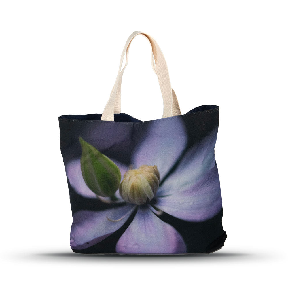 Close-up picture of the clematis taiga flower on the market tote with a white background