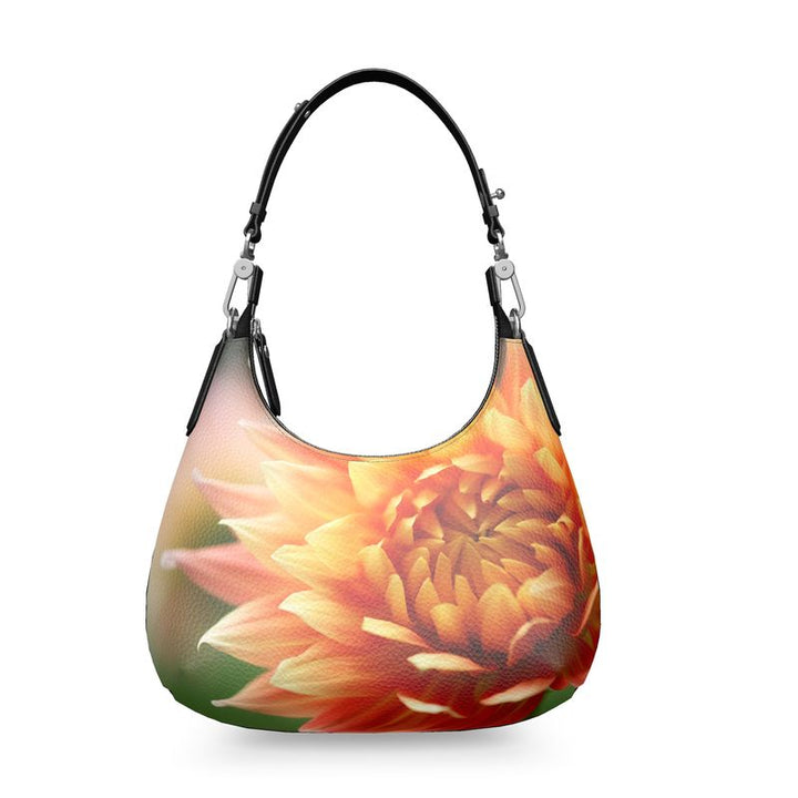 The Dahlia Mini Curve Designer Leather Bag features a vibrant floral design, blending style with practicality.