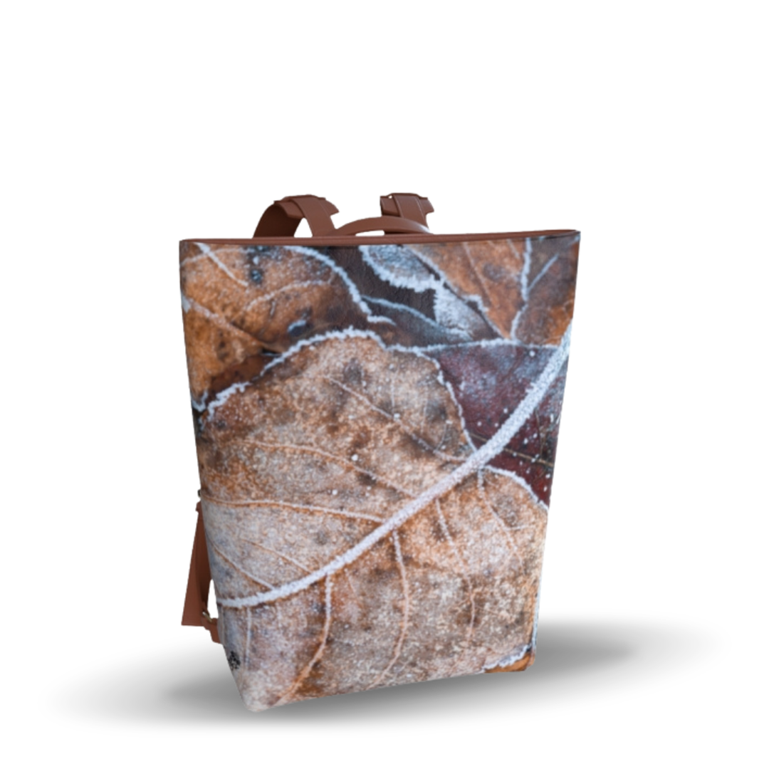Stylish and durable, the Frosted Leaf Faux Leather Backpack features a beautiful photograph of frosted leaves for a trendy accessory.