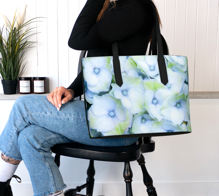 Stylish Hydrangea Faux Leather Handbag showcasing floral design, perfect for eco-friendly fashion lovers.