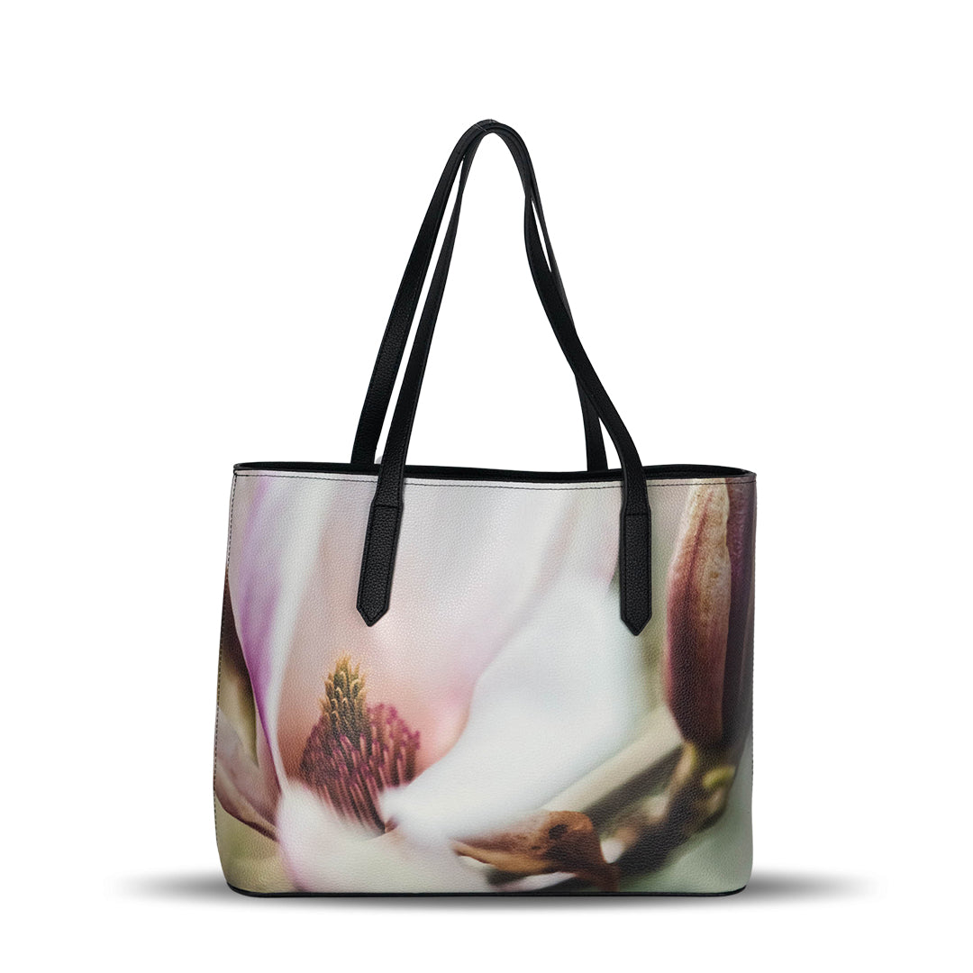 Elevate your style with the Magnolia Faux Leather Handbag, featuring a stunning floral design and eco-friendly materials.