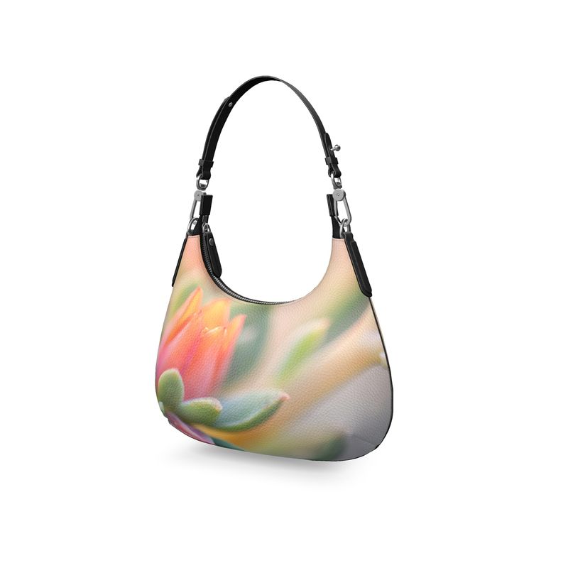 The 'Succulent' Mini Curve Bag showcases a beautiful succulent print on high-quality leather, blending style and nature.