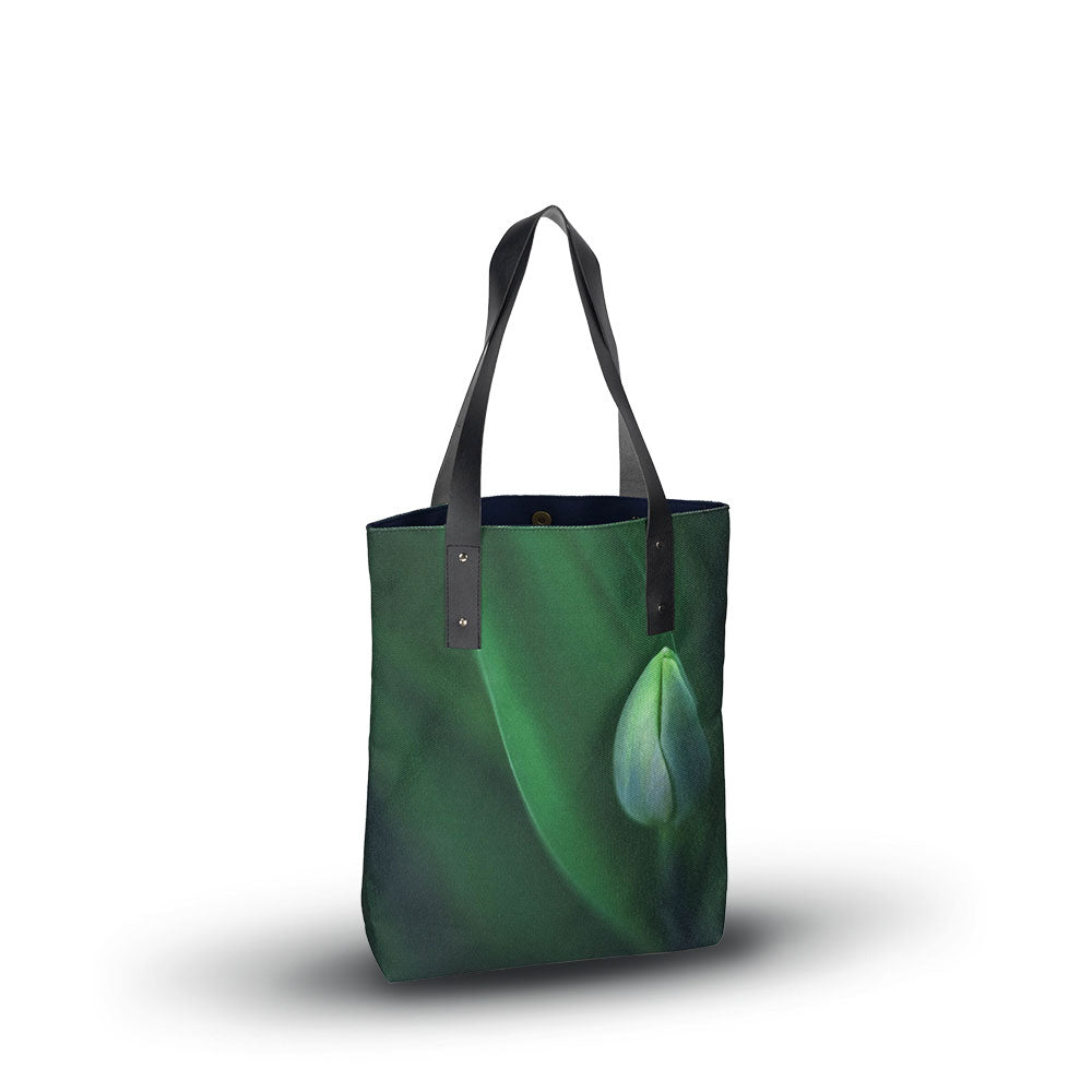 tote bag with close-up image of a tulip bud in green.