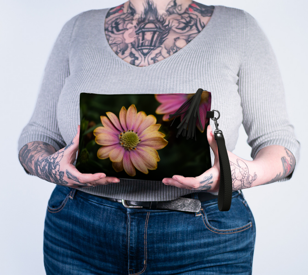 lady holding the windflower vegan leather makeup bag