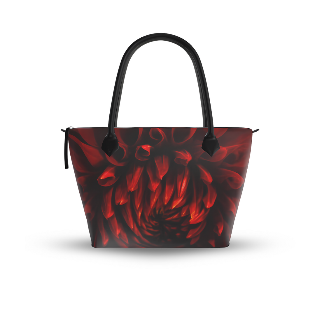 Crimson dahlia zip top handbag with rich red swirling petals on a dark background, structured silhouette with black leather handles and top zipper closure, botanical art design by Sally Halvorsen. Canvas Weave