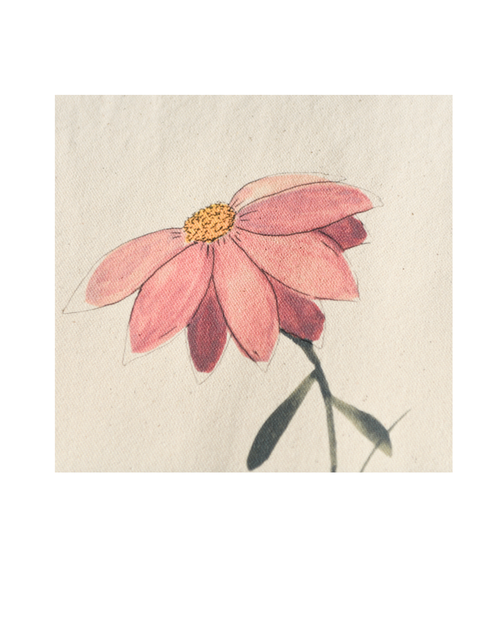 Close-up of the In Her Own Way watercolor artwork showing delicate pink, coral, and yellow floral details printed on canvas.