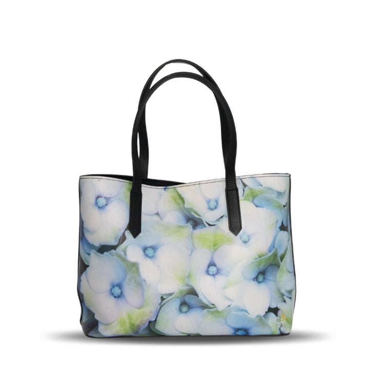 Hydrangea vegan leather tote bag featuring a fine art photograph of layered blue and violet hydrangea petals by Sally Halvorsen.
