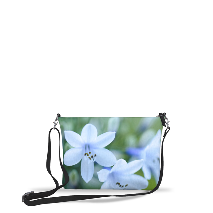 Lily’s vegan leather crossbody purse featuring a fine art photograph of a luminous white lily bloom by Sally Halvorsen.
