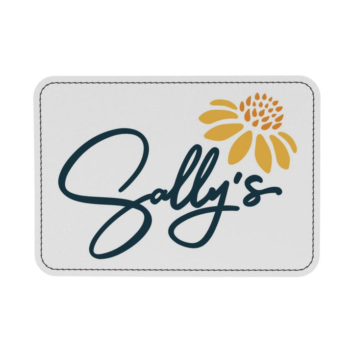label this is sewn on the inside of the bag featuring the name Sally's with a yellow artistic flower on the upper right corner.