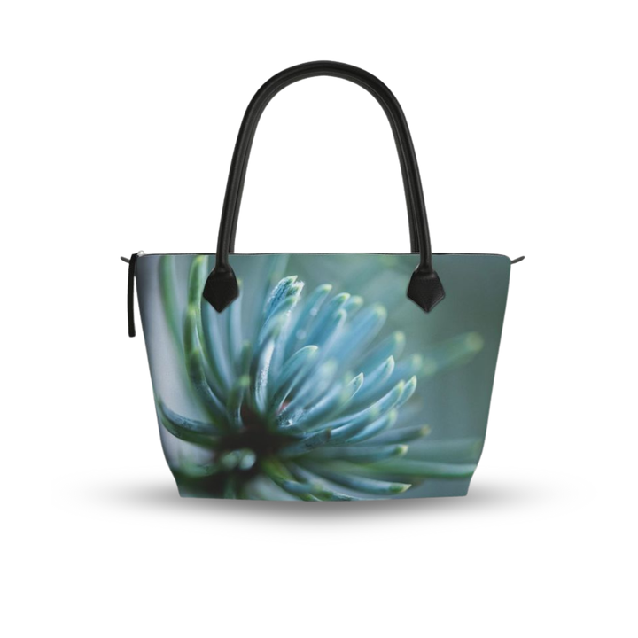 Structured zip top handbag featuring Spring Rain botanical artwork, leather handles, interior pockets, and 17-inch laptop capacity. Monroe Satin