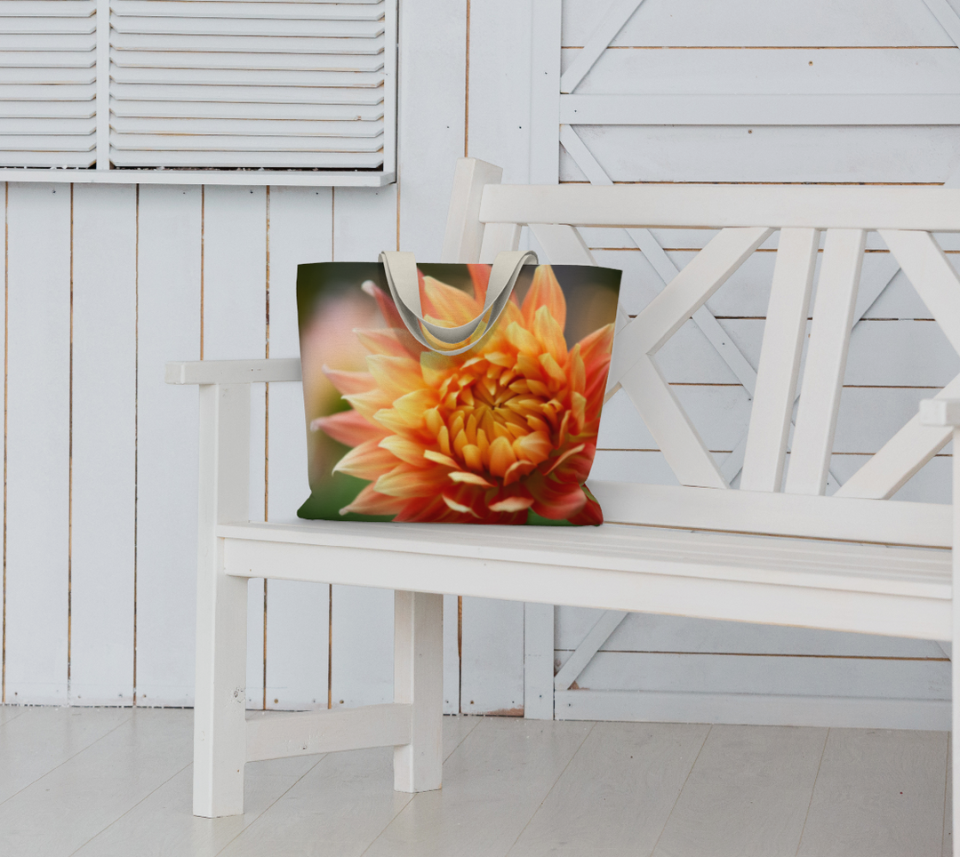 Stylish Orange-Yellow Dahlia Market Tote displayed on a bench, perfect for vibrant everyday outings.