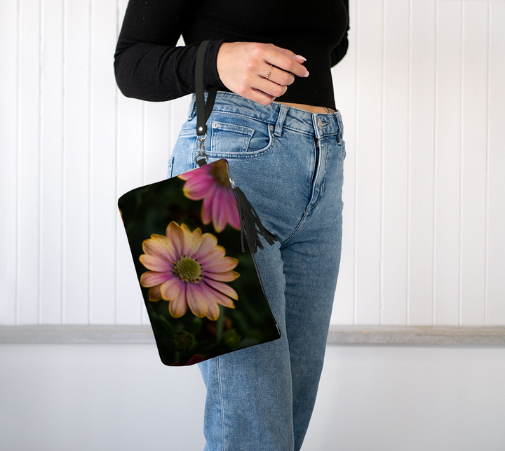 Lady holding the windflower vegan leather makeup bag on her wrist