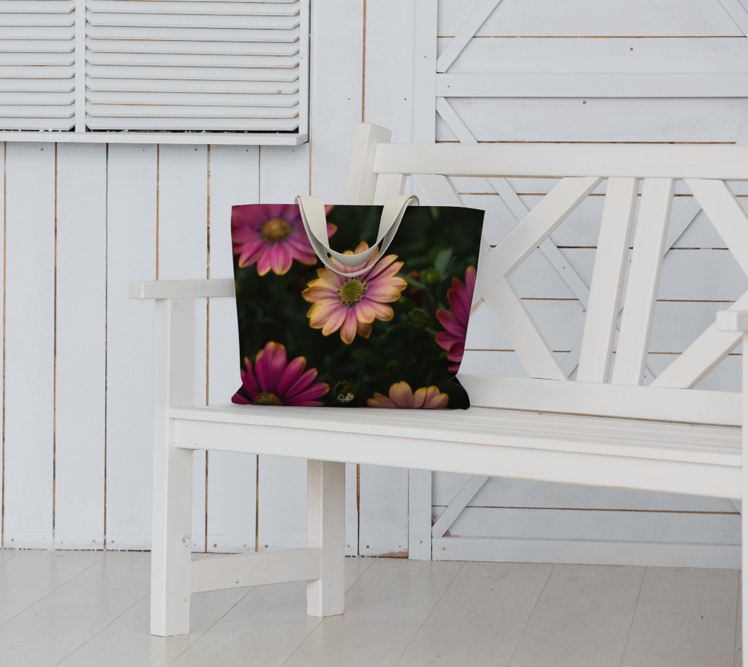 Stylish Windflower Market Tote rests on a white bench, perfect for errands and weekend getaways with floral design.