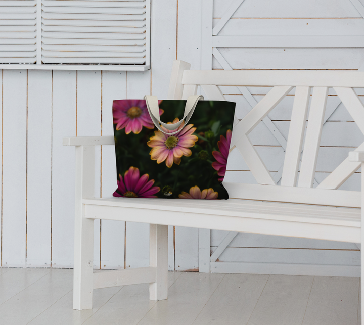Stylish Windflower Market Tote rests on a white bench, perfect for errands and weekend getaways with floral design.