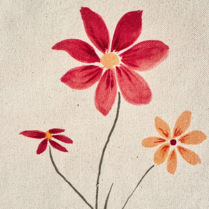 Close-up of the Better Together watercolor artwork printed on natural canvas, showing three colorful flowers and watercolor details.