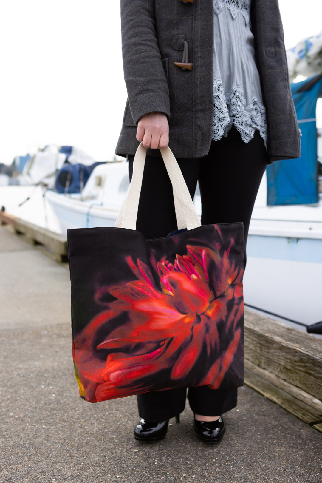 Red velvet market tote hanging at the side at the marina