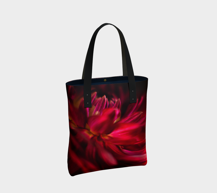 Canvas tote bag with a vibrant red dahlia on the front with black vegan leather handles