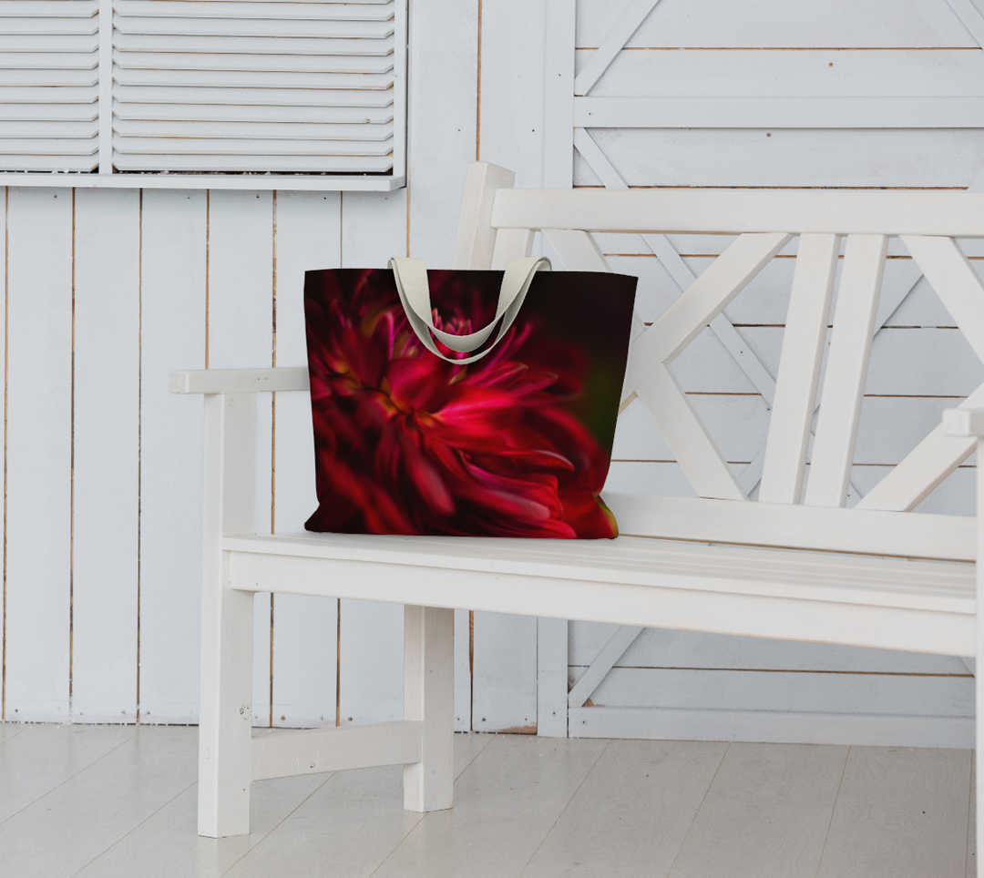 Stunning Red Dahlia Market Tote with 1.5 inch wide cotton handles in black or ivory on a bench