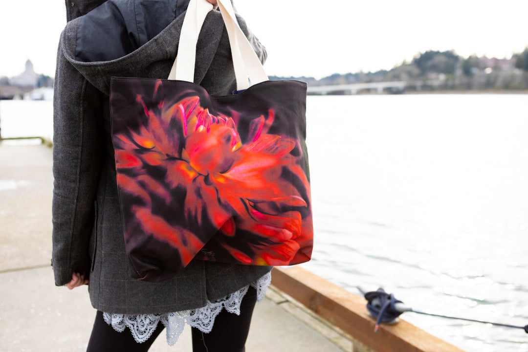 Red velvet market tote slung over models shoulder